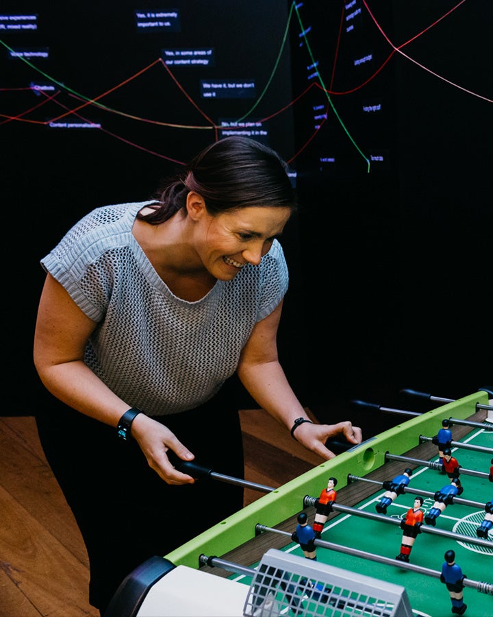 Woman playing foosball