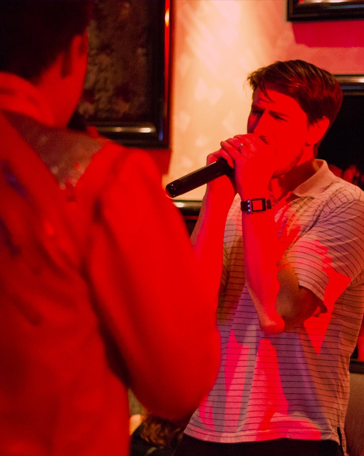 Man singing into a microphone