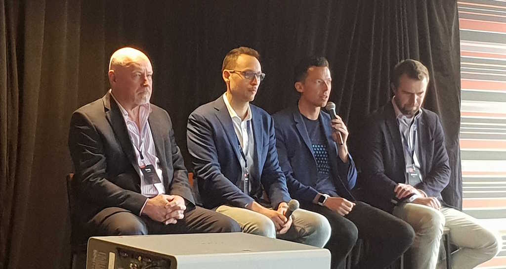 Adam speaking on panel at Kentico Connection