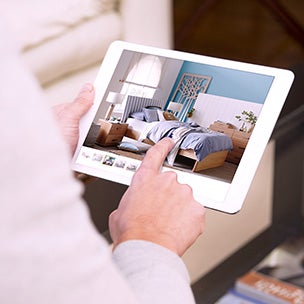 Hands using an iPad showing Snooze bed selector