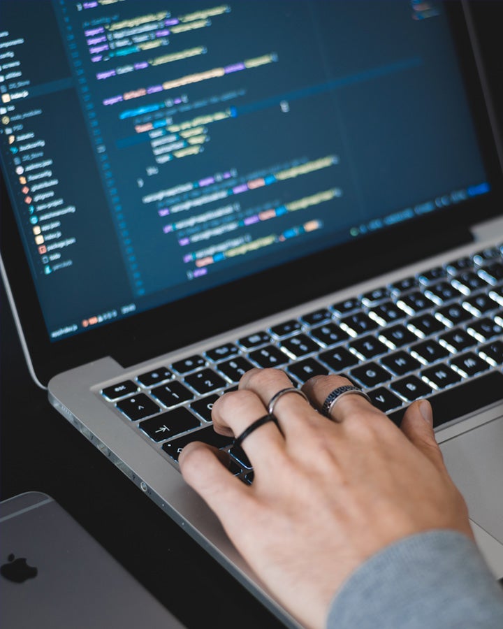 Hand on a laptop keyboard